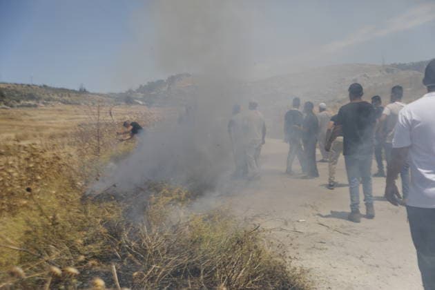 Palestinians gather near fire in agricultural land west of Hebron Palestinians and members of the Palestinian Civil Defense gather near the site of a fire on agricultural land around the village of Idhna, west of the West Bank city of Hebron, on June 2, 2026. Palestinian residents said Israeli settlers set fire to land in the area, while the Israeli army prevented residents from reaching it and intervened at the site. Photo by Mamoun Wazwaz apaimages Hebron West Bank Palestinian Territory 020626_Hebron_MW_00(2) Copyright: xapaimagesxMamounxWazwazx xapaimagesx