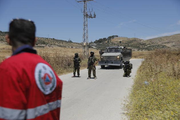 Palestinians gather near fire in agricultural land west of Hebron Palestinians and members of the Palestinian Civil Defense gather near the site of a fire on agricultural land around the village of Idhna, west of the West Bank city of Hebron, on June 2, 2026. Palestinian residents said Israeli settlers set fire to land in the area, while the Israeli army prevented residents from reaching it and intervened at the site. Photo by Mamoun Wazwaz apaimages Hebron West Bank Palestinian Territory 020626_Hebron_MW_00(12) Copyright: xapaimagesxMamounxWazwazx xapaimagesx