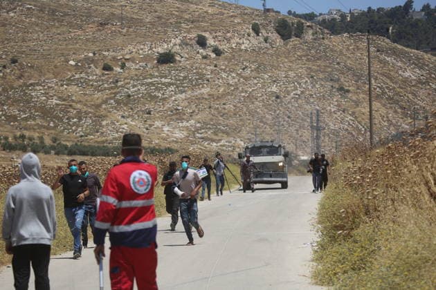 Palestinians gather near fire in agricultural land west of Hebron Palestinians and members of the Palestinian Civil Defense gather near the site of a fire on agricultural land around the village of Idhna, west of the West Bank city of Hebron, on June 2, 2026. Palestinian residents said Israeli settlers set fire to land in the area, while the Israeli army prevented residents from reaching it and intervened at the site. Photo by Mamoun Wazwaz apaimages Hebron West Bank Palestinian Territory 020626_Hebron_MW_00(14) Copyright: xapaimagesxMamounxWazwazx xapaimagesx