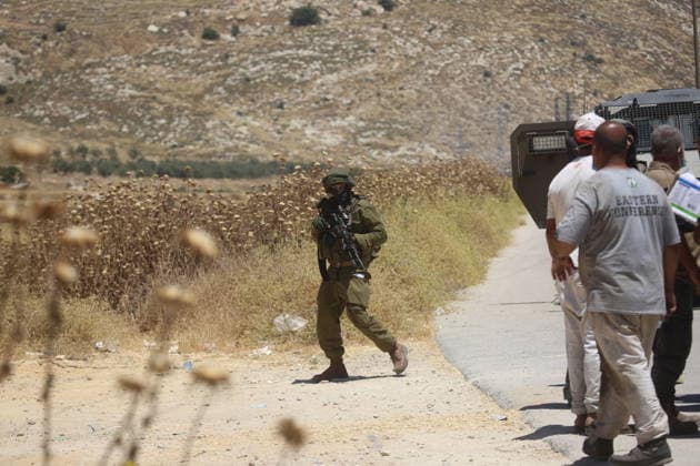 Palestinians gather near fire in agricultural land west of Hebron Palestinians and members of the Palestinian Civil Defense gather near the site of a fire on agricultural land around the village of Idhna, west of the West Bank city of Hebron, on June 2, 2026. Palestinian residents said Israeli settlers set fire to land in the area, while the Israeli army prevented residents from reaching it and intervened at the site. Photo by Mamoun Wazwaz apaimages Hebron West Bank Palestinian Territory 020626_Hebron_MW_00(18) Copyright: xapaimagesxMamounxWazwazx xapaimagesx