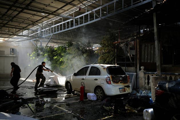 June 2, 2026, Tyre, Tyre, Lebanon: A fire fighter douses fire at a parking lot of Jabal Amel Hospital that was destroyed in Israeli air strikes in the southern Lebanese port city of Tyre. Clashes have continued in southern Lebanon despite Israel and Hezbollah accepting a US plan for a partial ceasefire. President Donald Trump said he had spoken to both sides and they agreed that all shooting will stop , after Iran warned Israeli military actions in Lebanon were a threat to the US-Iran ceasefire. Tyre Lebanon - ZUMAn313 20260602_zip_n313_014 Copyright: xMarwanxNaamanix