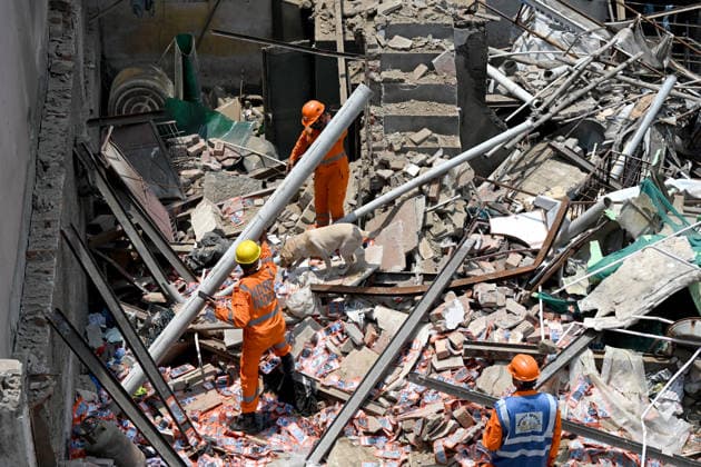 NEW DELHI, INDIA - JUNE 2: NDRF team conducts a search and rescue operation as a building collapsed after the cylinder blast in Mukundpur, Burari, on June 2, 2026 in New Delhi, India. Neighbours and officials alleged that a large number of cylinders were being stored illegally inside the house where the blast occurred. (Photo by Ishant Chauhan Hindustan Times ) House Collapses After Cylinder Blast In Delhi™s Mukundpur, People Feared Trapped Under Debris