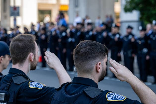 June 2, 2026, Arlington, Virginia, United States: The funeral procession for ARLINGTON COUNTY POLICE CORPORAL BARRY FOUST passes Arlington County Police Headquarters one final time following funeral services. Foust died after battling a 9 11-related illness linked to his service as a Pentagon first responder on September 11, 2001. Arlington United States  - ZUMAk206 20260602_znp_k206_014 Copyright: xMattxKaminskyx