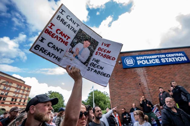 June 2, 2026, London, United Kingdom: Protestor outside Southampton Central Police Station holds a placard during the rally. Southampton locals organized a flash protest following the release of Police body-cam footage of the arrest and subsequent death of Henry Nowak. The 18 year old was handcuffed by Hampshire Constabulary who accused him of racial abuse and did not believe that he had been stabbed. He subsequently bled to death in custody. The protest outside Southampton Central Police Station accused the government of 2 tier policing. London United Kingdom  - ZUMAs197 20260602_aaa_s197_095 Copyright: xLabxMox