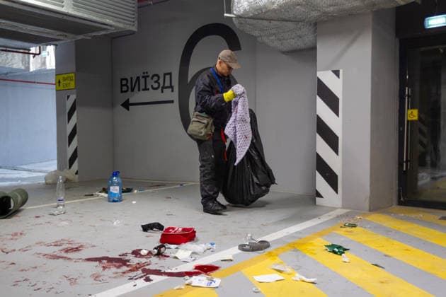RECORD DATE NOT STATED A cleaner collects blood-stained towels from the floor of a parking garage at a residential complex in the Shevchenkivskyi district of Kyiv, Ukraine, on June 2, 2026. The towels were left behind after the evacuation of a person injured in a massive Russian attack (Photo by Kyrylo Chubotin Ukrinform) Residential complex damaged in Shevchenkivskyi district following Russian attack  Copyright: xKyryloxChubotinx