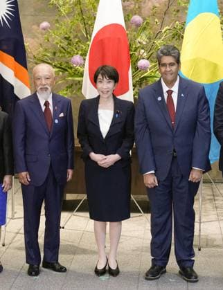 Japan PM Takaichi meets island nation leaders Japanese Prime Minister Sanae Takaichi (C) poses for a photo at the prime minister s office in Tokyo on June 2, 2026, ahead of her meeting with leaders of island nations.  A14AA0005617447P