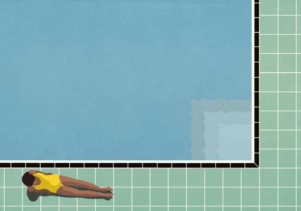 View from above of woman sunbathing, relaxing next to sunny summer swimming pool  Copyright: MaltexMueller fStopImages2103052