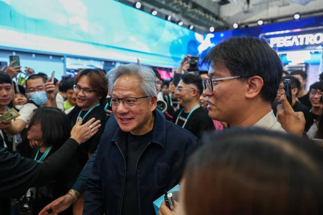 NVIDIA s CEO Jensen Huang visits COMPUTEX TAIPEI 2026 TAIPEI, TAIWAN - JUNE 3: Jensen Huang, the CEO of American multinational tech giant NVIDIA, is surrounded by heaps of supporters and staff during his visit to the COMPUTEX TAIPEI trade show, in Taipei, Taiwan, on June 3, 2026. COMPUTEX TAIPEI is one of the world’s largest and most significant trade shows, featuring latest technologies, drones, data centres, Artificial Intelligence (AI) technologies, supercomputers, semiconductors products and other things from major international firms such as Nvidia, Intel, NXP and Foxconn. Daniel Ceng Anadolu Taipei Taiwan. Editorial use only. Please get in touch for any other usage.  Copyright: x2026xAnadoluxDanielxCengx