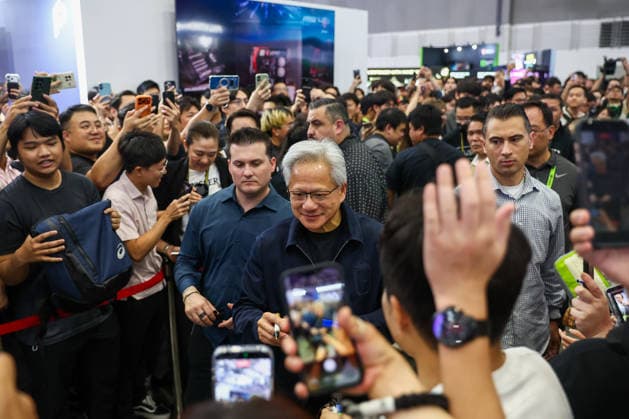 NVIDIA s CEO Jensen Huang visits COMPUTEX TAIPEI 2026 TAIPEI, TAIWAN - JUNE 3: Jensen Huang, the CEO of American multinational tech giant NVIDIA, signs autographs for fans as he is surrounded by heaps of supporters and staff during his visit to the COMPUTEX TAIPEI trade show, in Taipei, Taiwan, on June 3, 2026. COMPUTEX TAIPEI is one of the world’s largest and most significant trade shows, featuring latest technologies, drones, data centres, Artificial Intelligence (AI) technologies, supercomputers, semiconductors products and other things from major international firms such as Nvidia, Intel, NXP and Foxconn. Daniel Ceng Anadolu Taipei Taiwan. Editorial use only. Please get in touch for any other usage.  Copyright: x2026xAnadoluxDanielxCengx