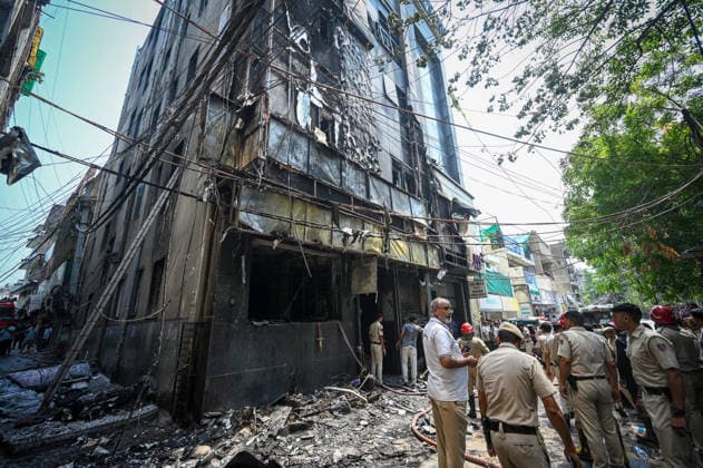 NEW DELHI, INDIA - JUNE 3: Firefighters and rescue personnel conduct rescue and recovery operations after a massive fire broke out in a five-storey building housing a restaurant and bed-and-breakfast guest accommodation in the highly congested Hauz Rani area of Malviya Nagar on June 3, 2026 in New Delhi, India. The blaze at the Flourish Stay B&B and Lemon Green Restaurant started around 8.30 am and quickly spread, catching everybody unawares. Rescue workers, including many locals, rushed to the spot to pull out those trapped inside the five-floor narrow building. About 40 people were rescued and rushed to hospital where 21 were declared brought dead, officials said. The death toll could rise with several of the injured in a critical conditi