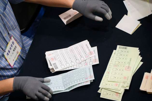 June 3, 2026, Seoul, South Korea: Ballots are sprawled across a tabletop as poll workers count them after the conclusion of voting in South KoreaÃ¢â‚¬â ¢s local elections on Wednesday, June 3, 2026 in Seoul, South Korea. Seoul South Korea  - ZUMAh163 20260603_znp_h163_027 Copyright: xJintakxHanx