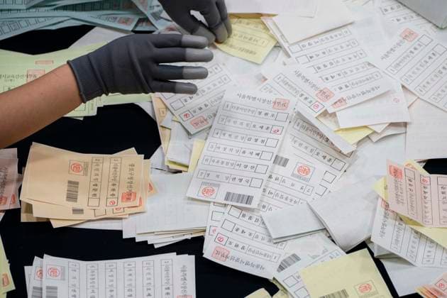 June 3, 2026, Seoul, South Korea: Ballots are sprawled across a tabletop as poll workers count them after the conclusion of voting in South KoreaÃ¢â‚¬â ¢s local elections on Wednesday, June 3, 2026 in Seoul, South Korea. Seoul South Korea  - ZUMAh163 20260603_znp_h163_026 Copyright: xJintakxHanx