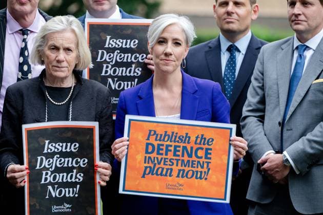 June 3, 2026, London, England, United Kingdom: DAISY COOPER (centre), Deputy Leader of the Liberal Democrats and Liberal Democrat Treasury spokesperson, holds a placard as Liberal Democrat MPs stage a rally in Westminster calling on the Government to publish the delayed Defence Investment Plan and back proposals for Defence Bonds, following the anniversary of the Strategic Defence Review s publication. London United Kingdom - ZUMAk172 20260603_zip_k172_018 Copyright: xThomasxKrychx