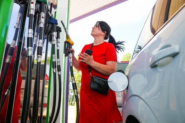 RUSSIA, SEVASTOPOL - JUNE 3, 2026: A woman fills up her vehicle at a petrol station. Maxim Churusov TASS  93335699
