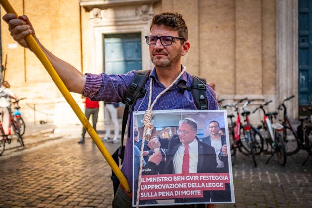 June 3, 2026, Rome, Rm, Italy: Activists gather near Montecitorio, the Chamber of Deputies, to tell the Italian government: no more complicity with Israel, no more silence in the face of human rights violations and no more trade and military agreements. An activist shows an image of the Israeli Minister Ben-Gvir. Minister Ben-Gvir celebrates the passage of the death penalty law reads the sign. Rome Italy  - ZUMAg256 20260603_znp_g256_005 Copyright: xMarcoxDixGianvitox