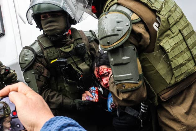 Thousands of students take to Chilean streets over planned education cuts SANTIAGO, CHILE - JUNE 3: (EDITOR S NOTE: Image depicts graphic content) A bleeding woman is arrested by police during an anti-government protest in Santiago, Chile, on June 3, 2026. Thousands of protesters took to the streets of Santiago to demonstrate against the austerity measures announced by President Jose Antonio Kast during his latest State of the Nation address. Cristobal Basaure Anadolu Santiago Chile. Editorial use only. Please get in touch for any other usage.  Copyright: x2026xAnadoluxCristobalxBasaurex