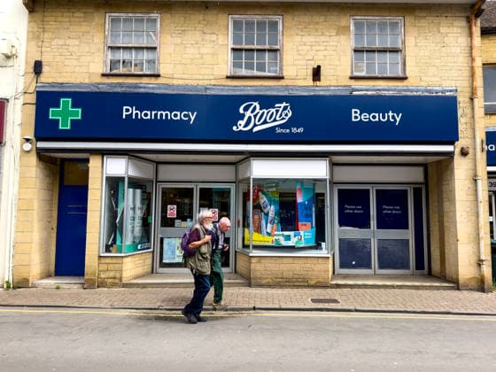 Logo signage photoshoot Cirencester England UK 2026 Boots pharmacy beauty shop Corporate logo sign Cirencester High Street, in Cotswolds Gloucestershire England United Kingdom Corporate sign May 2026 In England United Kingdom Copyright: xMarkxNewcombex