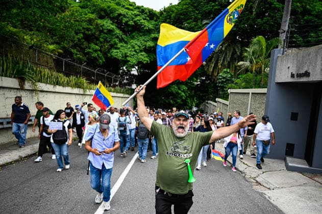 Protesters in Venezuela demand higher wages and presidential elections CARACAS, VENEZUELA - JUNE 3: A protester holds a Venezuelan flag during a march by public sector workers, students, and relatives of political prisoners heading to the U.S. Embassy to demand higher wages, decent working conditions, the release of political prisoners, and the calling of presidential elections in Caracas, Venezuela, June 3, 2026. Maxwell Briceno Anadolu Caracas Venezuela. Editorial use only. Please get in touch for any other usage.  Copyright: x2026xAnadoluxMaxwellxBricenox