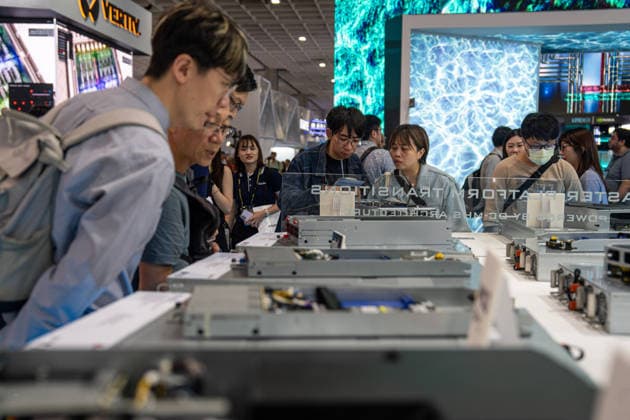 TAIWAN-COMPUTEX People looking at server rack components at Computex 2026 in Taipei, Taiwan, June 4, 2026. NEXPHER Vernon Yuen TAIPEI