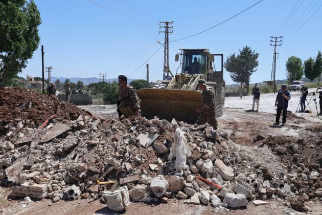 Lebanese Army announced that it has deployed to the town of Dibbin NABATIEH, LEBANON - JUNE 04: Israeli Army engineering vehicles clears the road by removing piles of dirt and rubble as the Lebanese Army announced that it had entered, where Israeli forces had recently withdrawn after carrying out attacks in the town of Dibbin, Nabatieh, Lebanon, on June 04, 2026. Ramiz Dallah Anadolu Nabatieh Lebanon. Editorial use only. Please get in touch for any other usage.  Copyright: x2026xAnadoluxRamizxDallahx