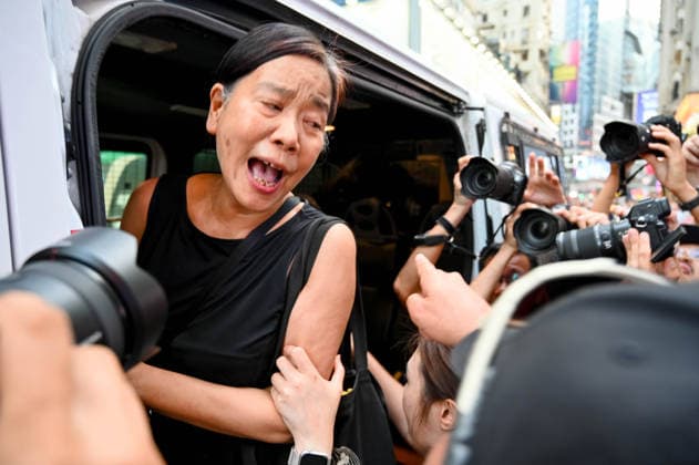 June 4, 2026, Hong Kong, China: Hong Kong left-wing activist Chan Po-ying is being detained by the police officers in Causeway Bay near Victoria Park where people traditionally gathered annually to mourn the victims of China s Tiananmen Square crackdown in 1989. Hong Kong police officers patrol the streets as authorities enforce strict measures on the 37th anniversary of the 1989 Tiananmen Square events. Hong Kong China  - ZUMAt141 20260604_aap_t141_010 Copyright: xKeithxTsujix