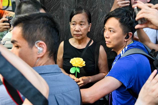June 4, 2026, Hong Kong, China: Hong Kong left-wing activist Chan Po-ying is being detained by the police officers in Causeway Bay near Victoria Park where people traditionally gathered annually to mourn the victims of China s Tiananmen Square crackdown in 1989. Hong Kong police officers patrol the streets as authorities enforce strict measures on the 37th anniversary of the 1989 Tiananmen Square events. Hong Kong China  - ZUMAt141 20260604_aap_t141_008 Copyright: xKeithxTsujix