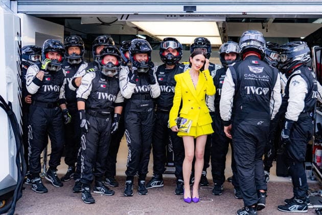 2026 Formula 1 Louis Vuitton Monaco Grand Prix Lily Jane Collins (GBR) (USA) filming the upcoming season of Emily in Paris in the pitlane at the Cadillac Garage with the pit crew on Media Day during the 2026 Formula 1 Louis Vuitton Monaco Grand Prix at the Monaco Street Circuit on June 4, 2026. Photo by ABACAPRESS.COM Monaco Monaco  Copyright: xABACAx