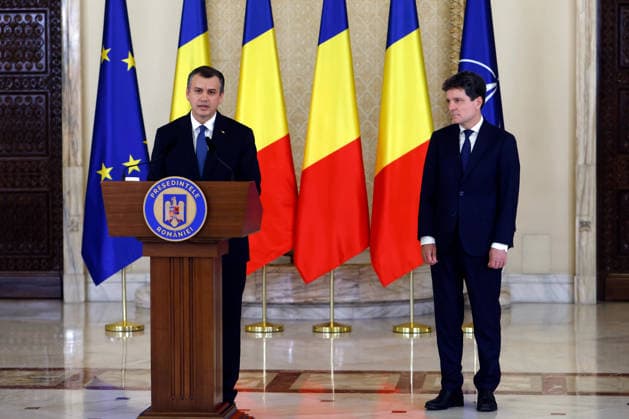 (260604) -- BUCHAREST, June 4, 2026 -- Romania s prime minister-designate Eugen Tomac (L) delivers a speech after being nominated by President Nicusor Dan as Nicusor Dan stands by at Cotroceni palace in Bucharest, Romania, on June 4, 2026. Romanian President Nicusor Dan on Thursday nominated his adviser Eugen Tomac as prime minister-designate. (Photo by Xinhua) ROMANIA-BUCHAREST-PM-DESIGNATE CristianxCristel 