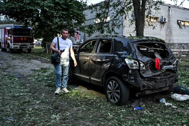 A man stands by a car, damaged by a Russian drone strike on the Shevchenkivskyi district of Zaporizhzhia, Ukraine, June 4, 2026. Russian forces launched a drone strike on one of the city’s residential areas, killing one person and injuring 16 others. The blast wave and debris shattered windows and balconies in apartment blocks. (Photo by Dmytro Smolienko Ukrinform) Russian forces launch drone strike on district in Zaporizhzhia  Copyright: xDmytroxSmolienkox