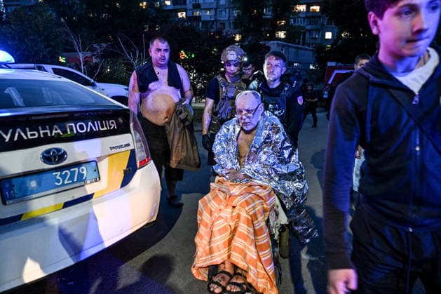 Volunteers help an injured man, wrapped in a space blanket, reach an ambulance during a response effort to a Russian drone strike on a residential area in the Shevchenkivskyi district of Zaporizhzhia, Ukraine, June 4, 2026. Russian forces launched a drone strike on one of the city’s residential areas, killing one person and injuring 16 others. The blast wave and debris shattered windows and balconies in apartment blocks. (Photo by Dmytro Smolienko Ukrinform) Russian forces launch drone strike on district in Zaporizhzhia  Copyright: xDmytroxSmolienkox