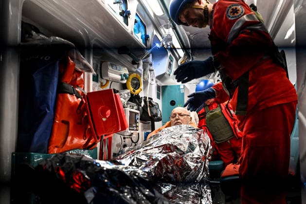 Medics attend to a man, covered with a space blanket, in an ambulance during a response effort to a Russian drone strike on a residential area in the Shevchenkivskyi district of Zaporizhzhia, Ukraine, June 4, 2026. Russian forces launched a drone strike on one of the city’s residential areas, killing one person and injuring 16 others. The blast wave and debris shattered windows and balconies in apartment blocks. (Photo by Dmytro Smolienko Ukrinform) Russian forces launch drone strike on district in Zaporizhzhia  Copyright: xDmytroxSmolienkox