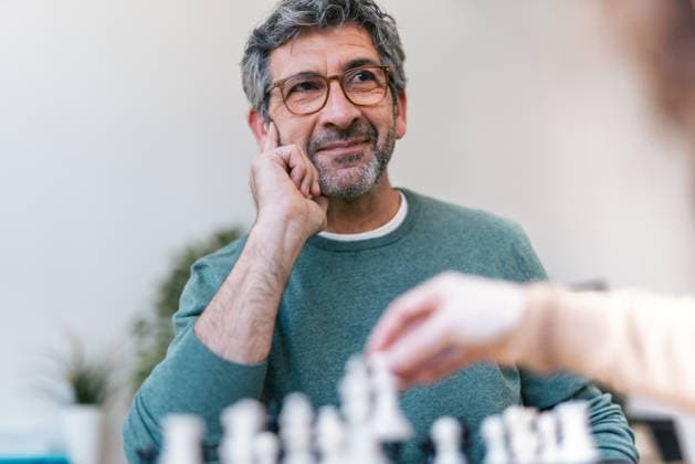 Thinking about strategy during a chess match indoors model released, Symbolfoto property released, JSRF04432