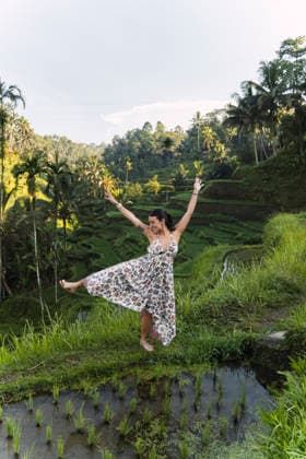 Happy tourist dancing at a green rice field in Bali model released, Symbolfoto property released, PNAF06964