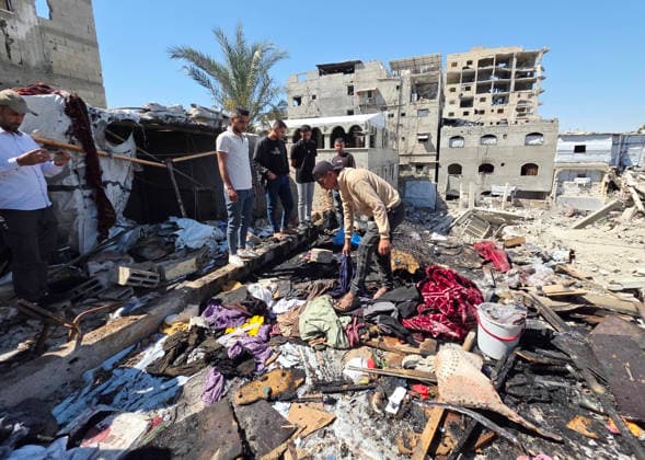 Palestinians Inspect Site of Deadly Strike in Khan Younis Palestinians inspect the damage at the site of an Israeli strike that targeted a tent belonging to the family of Mohannad Farwana on the rooftop of their home in central Khan Younis, southern Gaza Strip, on June 6, 2026. Farwana was killed after the tent caught fire in the strike, just hours before his scheduled wedding ceremony. Photo by Tariq Mohammad APA Images Khan Yunis Gaza Strip Palestinian Territory 060626_Khan_Yunis_TM_00(24) Copyright: xapaimagesxTariqxMohammad xapaimagesx