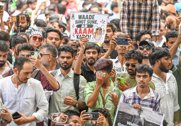 NEW DELHI, INDIA - JUNE 6: A Cockroach Janta Party (CJP) supporter during a protest over alleged irregularities in the country s major examinations on June 6, 2026 in New Delhi, India. Members and supporters of the Cockroach Janta Party (CJP) protest at Jantar Mantar to demand the resignation of Union Minister of Education, Dharmendra Pradhan. They claimed him to be directly responsible for the recent exam paper leaks in major national-level examinations across the country, including NEET. The party was started as a satirical online movement after remarks made by Chief Justice Surya Kant during a hearing. CJI Kant compared a section of young unemployed youth with fake law degrees to cockroaches. (Photo by Raj K Raj Hindustan Tim