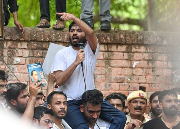 NEW DELHI, INDIA - JUNE 6: Cockroach Janta Party (CJP) founder Abhijeet Dipke, with Supporters during a protest demanding the resignation of Union Education Minister Dharmendra Pradhan over alleged examination-related lapses, at the Jantar Mantar on June 6, 2026 in New Delhi, India. Members and supporters of the Cockroach Janta Party (CJP) protest at Jantar Mantar to demand the resignation of Union Minister of Education, Dharmendra Pradhan. They claimed him to be directly responsible for the recent exam paper leaks in major national-level examinations across the country, including NEET. The party was started as a satirical online movement after remarks made by Chief Justice Surya Kant during a hearing. CJI Kant compared a section of y