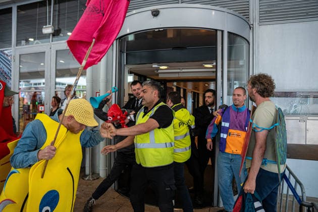 June 6, 2026, Rotterdam, South Holland, Netherlands: Rotterdam, Netherlands, 6 June 2026. Extinction Rebellion activists blocked the entrance to the Cruise Terminal on the Wilhelminakade on World Anti-Cruise Day. This temporarily preventing cruise passengers from boarding a moored cruise ship. Several activists were detained and four were arrested. Rotterdam Netherlands  - ZUMAp202 20260606_zip_p202_018 Copyright: xJamesxPetermeierx