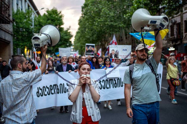 June 6, 2026, Tbilisi, Georgia: Tbilisi, Georgia, June 6, 2026. Protesters chant slogans as they walk to the Georgian Parliament building on the 556th day of anti-government rallies in Tbilisi. Tbilisi Georgia  - ZUMAz174 20260606_zip_z174_002 Copyright: xMoexZoyarix