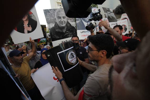 June 5, 2026, Tunis, Tunis, Tunisia, Tunisia: Demonstrators march through central Tunis during a protest demanding freedom of expression, independent public media, and an end to legal measures they say criminalize free speech, on June 5, 2026. The rally was organized in opposition to Decree-Law 54 and reflects growing concerns among civil society groups over restrictions on media freedoms and political dissent in Tunisia. Tunis Tunisia - ZUMAm342 20260605_zsp_m342_012 Copyright: xHasanxMradx