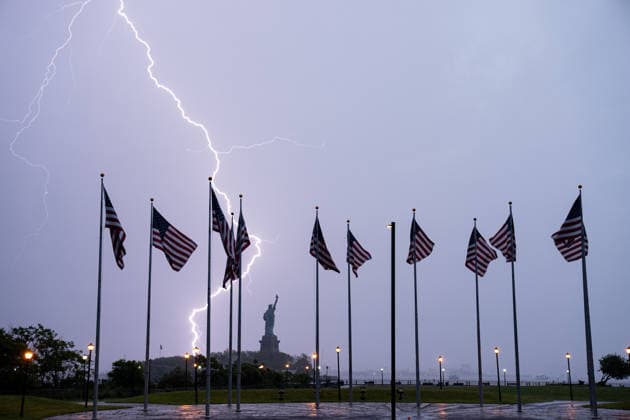 Lightning Flashes Behind The Statue of Liberty as Storm Hits New York NEW YORK, UNITED STATES – JUNE 6: Lightning flashes across New York Harbor during a powerful thunderstorm as the Statue of Liberty and American flags are seen in the background in New York City, United States, on June 6, 2026. Heavy rain, strong winds and frequent lightning affected parts of the New York metropolitan area as severe weather moved through the region. Lokman Vural Elibol Anadolu New York United States. Editorial use only. Please get in touch for any other usage.  Copyright: x2026xAnadoluxLokmanxVuralxElibolx