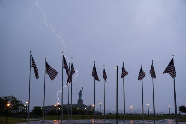 Lightning Flashes Behind The Statue of Liberty as Storm Hits New York NEW YORK, UNITED STATES – JUNE 6: Lightning flashes across New York Harbor during a powerful thunderstorm as the Statue of Liberty and American flags are seen in the background in New York City, United States, on June 6, 2026. Heavy rain, strong winds and frequent lightning affected parts of the New York metropolitan area as severe weather moved through the region. Lokman Vural Elibol Anadolu New York United States. Editorial use only. Please get in touch for any other usage.  Copyright: x2026xAnadoluxLokmanxVuralxElibolx