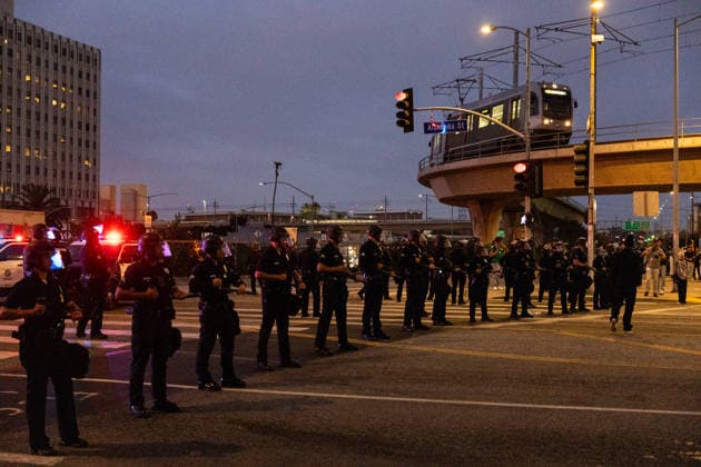 LOS ANGELES, CA - JUNE 06: Police officers stand guard outside a federal detention center during an anti-ICE protest on June 6, 2026 in Los Angeles, California.  Copyright: xVCGx 111646651203