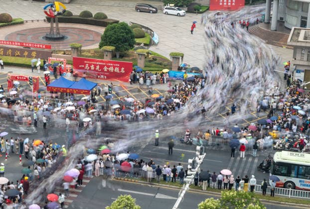 (260607) -- BEIJING, June 7, 2026 -- Students exit a national college entrance examination site, where parents await them outside, in Huai an, east China s Jiangsu Province, June 7, 2026. Some 12.9 million people across China sat for the annual college entrance exam, or gaokao, on Sunday, a pivotal milestone for generations of young Chinese. (Photo by Xinhua) CHINA-COLLEGE ENTRANCE EXAM (CN) HexJinghua 