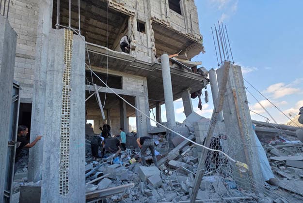 Palestinians Inspect Destruction After Strike on Displacement Area Palestinians inspect the destruction caused by an Israeli airstrike that targeted tents and shelters for displaced people in the Mawasi area of Khan Younis, southern Gaza Strip, on June 7, 2026. Debris and personal belongings were scattered across the sandy area as residents searched through the wreckage of their damaged shelters. Photo by Tariq Mohammad APA Images Khan Yunis Gaza Strip Palestinian Territory 070626_Khan_Yunis_TM_00(65) Copyright: xapaimagesxTariqxMohammad xapaimagesx