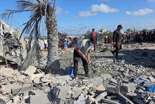 Palestinians Inspect Destruction After Strike on Displacement Area Palestinians inspect the destruction caused by an Israeli airstrike that targeted tents and shelters for displaced people in the Mawasi area of Khan Younis, southern Gaza Strip, on June 7, 2026. Debris and personal belongings were scattered across the sandy area as residents searched through the wreckage of their damaged shelters. Photo by Tariq Mohammad APA Images Khan Yunis Gaza Strip Palestinian Territory 070626_Khan_Yunis_TM_00(60) Copyright: xapaimagesxTariqxMohammad xapaimagesx