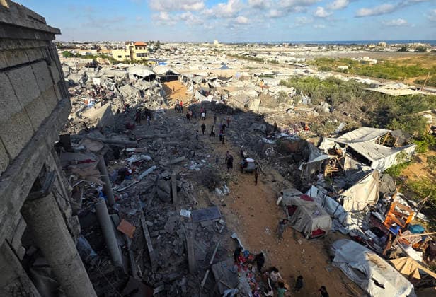 Palestinians Inspect Destruction After Strike on Displacement Area Palestinians inspect the destruction caused by an Israeli airstrike that targeted tents and shelters for displaced people in the Mawasi area of Khan Younis, southern Gaza Strip, on June 7, 2026. Debris and personal belongings were scattered across the sandy area as residents searched through the wreckage of their damaged shelters. Photo by Tariq Mohammad APA Images Khan Yunis Gaza Strip Palestinian Territory 070626_Khan_Yunis_TM_00(16) Copyright: xapaimagesxTariqxMohammad xapaimagesx
