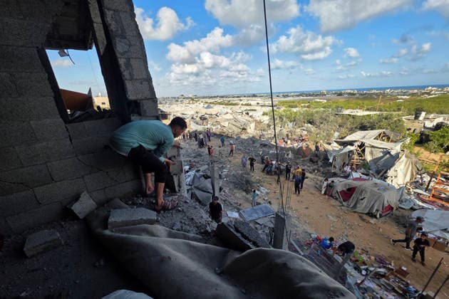 Palestinians Inspect Destruction After Strike on Displacement Area Palestinians inspect the destruction caused by an Israeli airstrike that targeted tents and shelters for displaced people in the Mawasi area of Khan Younis, southern Gaza Strip, on June 7, 2026. Debris and personal belongings were scattered across the sandy area as residents searched through the wreckage of their damaged shelters. Photo by Tariq Mohammad APA Images Khan Yunis Gaza Strip Palestinian Territory 070626_Khan_Yunis_TM_00(28) Copyright: xapaimagesxTariqxMohammad xapaimagesx