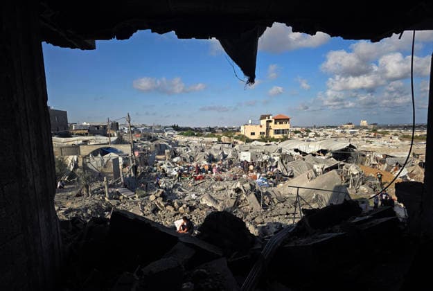 Palestinians Inspect Destruction After Strike on Displacement Area Palestinians inspect the destruction caused by an Israeli airstrike that targeted tents and shelters for displaced people in the Mawasi area of Khan Younis, southern Gaza Strip, on June 7, 2026. Debris and personal belongings were scattered across the sandy area as residents searched through the wreckage of their damaged shelters. Photo by Tariq Mohammad APA Images Khan Yunis Gaza Strip Palestinian Territory 070626_Khan_Yunis_TM_00(29) Copyright: xapaimagesxTariqxMohammad xapaimagesx