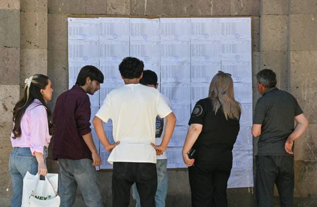 Armenia Parliamentary Election 9184767 07.06.2026 People read information about candidates at a polling station during the Armenian parliamentary election in Yerevan, Armenia. Yuri Kochetkov Sputnik Yerevan Armenia  Copyright: xYurixKochetkovx