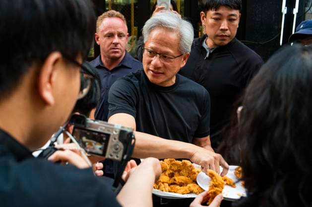 June 7, 2026, Seoul, South Korea: Nvidia founder and CEO JENSEN HUANG hands out fried chicken to members of the media as he eats and drinks beer with SK Group chairman Chey Tae-won at Kkanbu Chicken, during HuangÃ¢â‚¬â ¢s visit to Seoul, South Korea on Sunday, June 7, 2026. Seoul South Korea - ZUMAh163 20260607_znp_h163_004 Copyright: xJintakxHanx